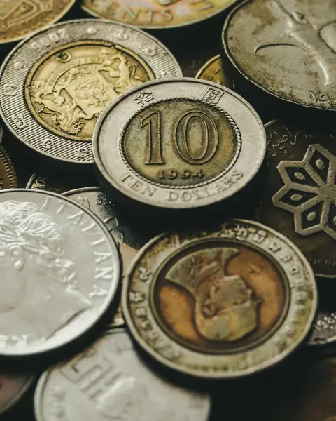 A pile of old gold and silver coins
